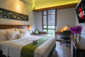 Postel nebo postele na pokoji v ubytování BATIQA Hotel Palembang + 37 fotografií