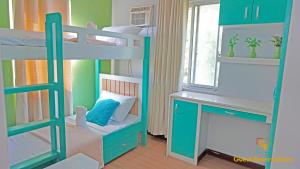 a room with a bunk bed and a desk at Palawan Villa Vacation HOME in Puerto Princesa City +20 photos