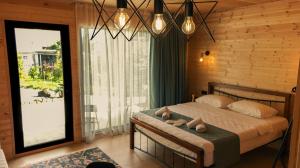Postel nebo postele na pokoji v ubytování Garden rooms in Kutaisi