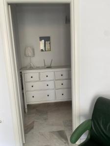 a bedroom with a dresser and a white dresser at Lovely place in Perea in Perea