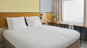 Postel nebo postele na pokoji v ubytování Original Sokos Hotel Royal