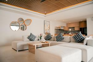 a living room with a couch and a table at Seminyak vila luxury 4Br near beach LAfavela in Seminyak