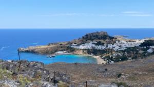 a view of a small island with a beach at Afandou Blue Apartment in Afantou +13 photos