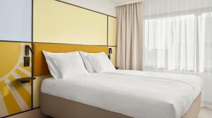 Postel nebo postele na pokoji v ubytování Original Sokos Hotel Royal