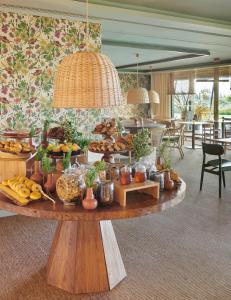 a buffet of food on a table in a room at Empordà Golf Resort in Torroella de Montgrí