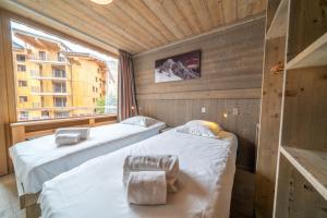 Postel nebo postele na pokoji v ubytování Appartement Le Rosset