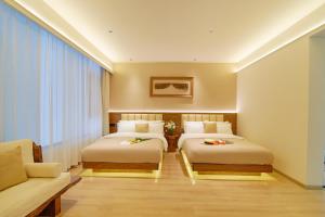 Postel nebo postele na pokoji v ubytování 夕露小榭南门机场大巴店Xiluxiaoxie MUXIN INN