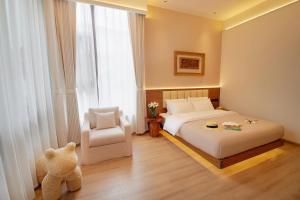 夕露小榭南门机场大巴店Xiluxiaoxie MUXIN INN客房内的一张或多张床位