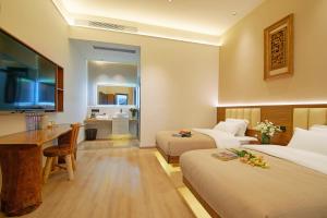 TV a/nebo společenská místnost v ubytování 夕露小榭南门机场大巴店Xiluxiaoxie MUXIN INN