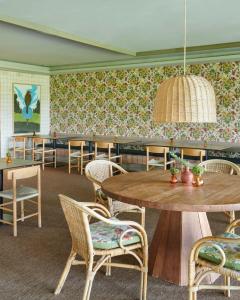 a dining room with a table and chairs at Empordà Golf Resort in Torroella de Montgrí