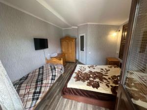 Katil atau katil-katil dalam bilik di Archil and Nino Gigauri Guest House