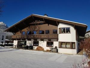 a large building with a gambrel roof at Appartement Sonnenspitze 5 in Ehrwald