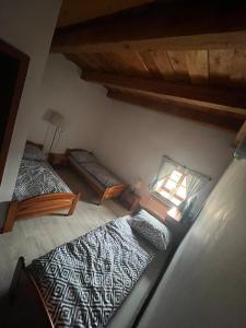 Postel nebo postele na pokoji v ubytování Penzion Tvrz