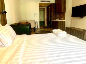 Ένα ή περισσότερα κρεβάτια σε δωμάτιο στο Roomy Suites @One Bukit Ceylon +34 φωτογραφίες