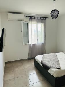 Ένα ή περισσότερα κρεβάτια σε δωμάτιο στο Appartement T2 Corte