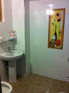 a bathroom with a sink and a toilet at Ace Hotel in To-dong