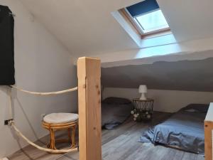 En eller flere senge i et værelse på Maison de ville cadurcienne plein centre