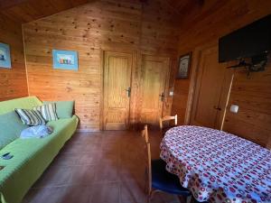 a bedroom with a bed in a wooden room at Casa de madera con piscina privada in Los Alcázares