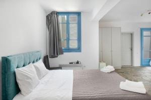 Postel nebo postele na pokoji v ubytování Efrossyni House