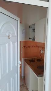 A cozinha ou cozinha compacta de Apartmani Vila Milaris