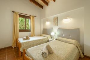Posteľ alebo postele v izbe v ubytovaní Finca ROTES Pollensa by Mallorca Villa Selection + 16 fotografií