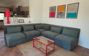 a living room with a couch and a coffee table at Mansarda sul verde in San Giorgio Montagna