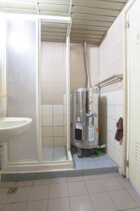 a bathroom with a shower and a mixer in it at Alan rooms for 2-4 people in Taipei