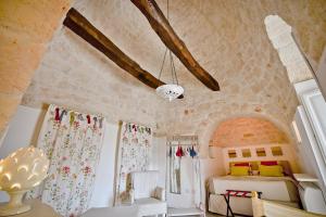 Posteľ alebo postele v izbe v ubytovaní Leonardo Trulli Resort