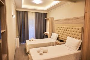 Posteľ alebo postele v izbe v ubytovaní Famissi Eden Hotel + 37 fotografií