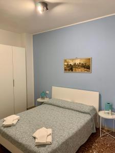 Postel nebo postele na pokoji v ubytování Vittoria Colonna
