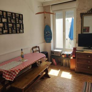 a living room with a table and a window at Les galets in Fouras