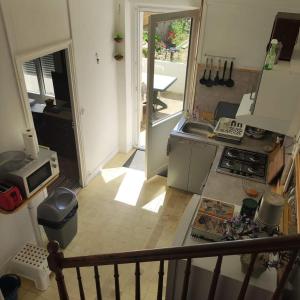 an overhead view of a kitchen with a sink and a stove at Les galets in Fouras