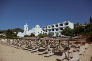 a bunch of chairs and umbrellas on a beach at Akti Hotel Kavala in Paleo Tsifliki