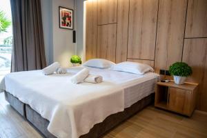 Postel nebo postele na pokoji v ubytování RiA BLU DELUXE HOTEL