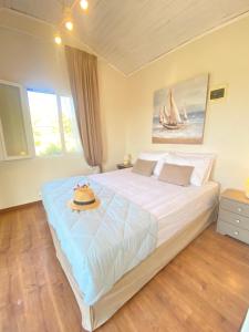 Ένα ή περισσότερα κρεβάτια σε δωμάτιο στο Dinateli Houses - Live like a local in Corfu