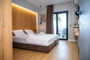 Postel nebo postele na pokoji v ubytování RiA BLU DELUXE HOTEL
