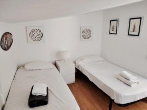 A bed or beds in a room at Baria I Adosado