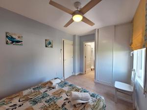 A bed or beds in a room at Baria I Adosado