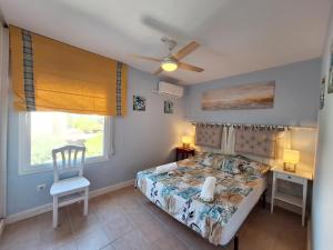 A bed or beds in a room at Baria I Adosado