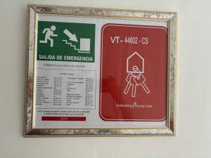 a sign in a frame hanging on a wall at Carlota y Vaquero House 2 in Vinaròs