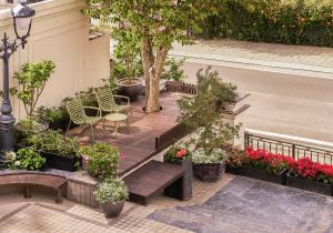 a garden with benches and flowers on a street at NIA Hotel in Da Lat +23 photos