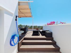 A balcony or terrace at Baria I Adosado
