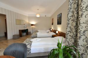 Posteľ alebo postele v izbe v ubytovaní Hotel Polonia