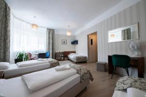 Posteľ alebo postele v izbe v ubytovaní Hotel Polonia