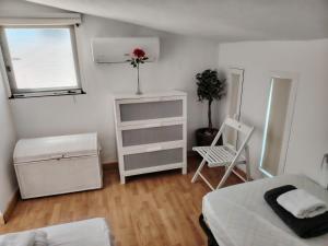 A bed or beds in a room at Baria I Adosado