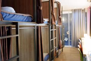 a group of bunk beds in a room at Sleep cafe @ Hidee in Bangkok