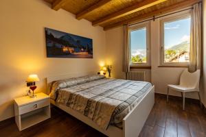 Posteľ alebo postele v izbe v ubytovaní Case Appartamenti Vacanze Da Cien