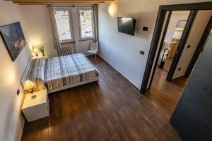 Posteľ alebo postele v izbe v ubytovaní Case Appartamenti Vacanze Da Cien