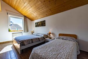 Posteľ alebo postele v izbe v ubytovaní Case Appartamenti Vacanze Da Cien