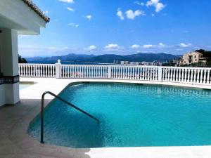 a swimming pool on a balcony of a building at ROYAL BEACH - Appartment with sea view & terrace in Faro de Cullera